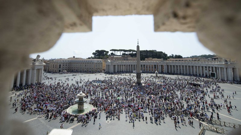 People in St. Peter's Square attend the Angelus led by Pope Francis from the window of his studio overlooking the square at the Vatican Aug. 22, 2021. (CNS photo/Vatican Media)