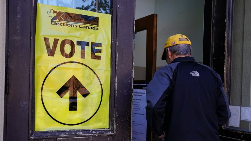 A man is pictured entering a polling place in Montreal Oct. 21, 2019. Although three in five Canadians felt having a federal election this fall was not important to them, the country is headed to its second general election in less than two years. (CNS photo/Carlo Allegri, Reuters)