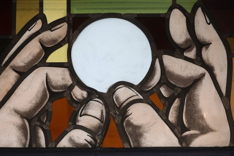 Elevation of the Eucharist is depicted in a stained-glass window at St. Anthony's Church in North Beach, Maryland, on July 15. (CNS/Bob Roller)
