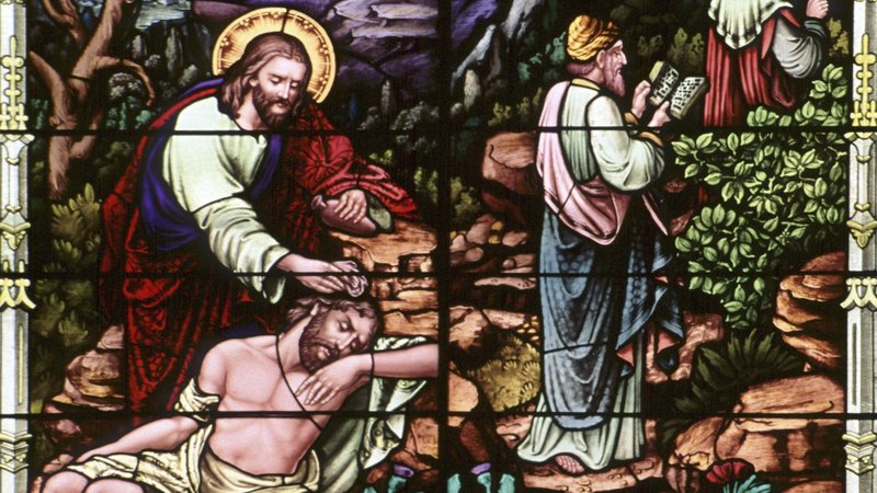 A stained-glass window at Sacred Heart Church in Freeport, Minn., depicts the good Samaritan. The 2,000-year-old parable of the good Samaritan is the anchor of the encyclical "Fratelli Tutti, on Fraternity and Social Friendship." (CNS photo/Gene Plaisted, The Crosiers)