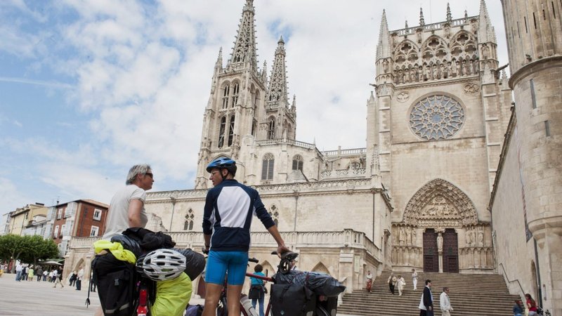 Pilgrims on bikes are pictured outside the Cathedral of Santiago de Compostela in Spain in this 2011 file photo. (Felix Ordonez/Reuters via CNS)