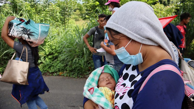Migrants and asylum-seekers from Central America and the Caribbean walk in a caravan in Tapachula, Mexico, Aug. 28, 2021. They are headed to the Mexican capital to apply for asylum and refugee status. (CNS photo/Jose Torres, Reuters)