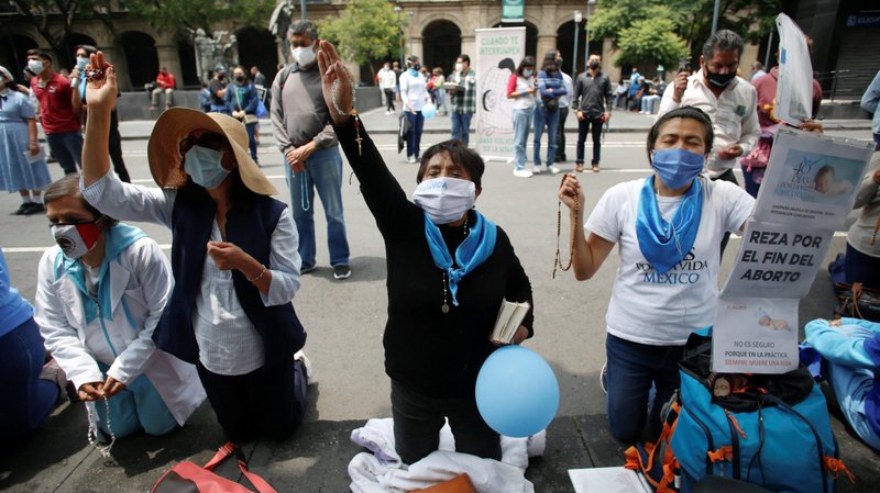 Catholics pray in Mexico City Sept. 7, 2021, as they protest the Mexican Supreme Court's decision that declared the criminalization of abortion is unconstitutional. (CNS photo/Gustavo Graf, Reuters)