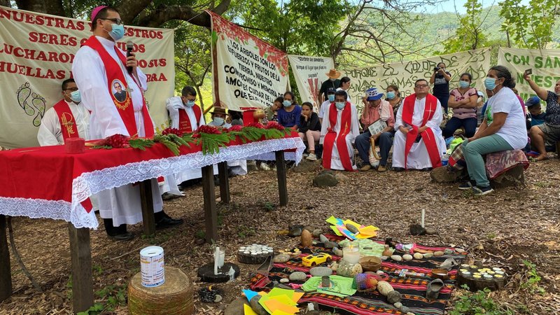 Bishop Oswaldo Estéfano Escobar Aguilar of Chalatenango, El Salvador, celebrates Mass on the banks of the Sumpul River May 14, 2021, during the commemoration of the 41st anniversary of the massacre of 600 people. (CNS photo/Rhina Guidos)