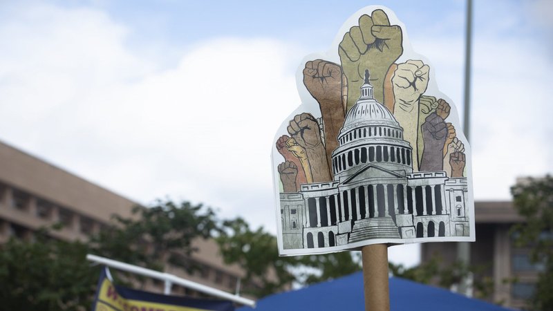 Migrant families and immigration advocates in Washington call for a pathway toward U.S. citizenship as they gather near Benjamin Banneker Park to march toward the U.S. Immigration and Customs Enforcement building Sept. 21, 2021. (CNS photo/Tyler Orsburn)