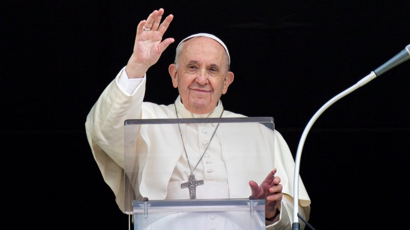 Pope Francis greets the crowd as he leads the Angelus from the window of his studio overlooking St. Peter's Square at the Vatican Sept. 26, 2021. (CNS photo/Vatican Media)