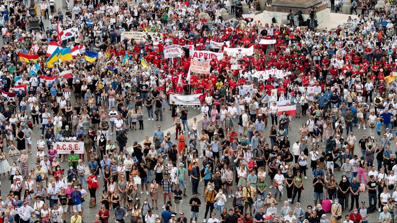 Pilgrims gather as Pope Francis leads the Angelus from the window of his studio overlooking St. Peter's Square at the Vatican Sept. 26, 2021. (CNS photo/Vatican Media)