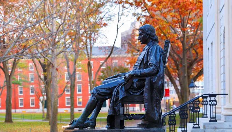 Statue of John Harvard on campus of Harvard University. (Jay Yuan/Shutterstock)