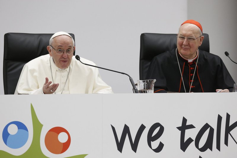 Pope Francis speaks at a pre-synod gathering of youth delegates in Rome in this 2018 file photo. Also pictured is U.S. Cardinal Kevin J. Farrell, prefect of the Vatican's Dicastery for Laity, Family and Life. (CNS/Paul Haring)