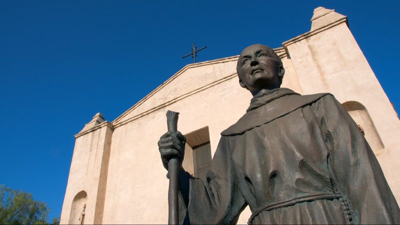 Statue of St. Junípero Serra in front of Mission San Gabriel Arcángel. (Byron W. Moore/Shutterstock)
