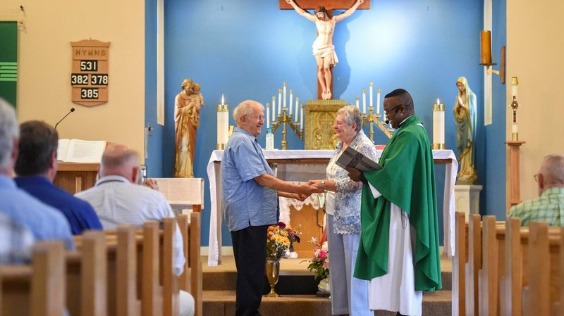 Father Simon Udemgba presides as Ray Germain and Joanne McKeon renew their wedding vows on their fifth wedding anniversary at St. Joseph's Catholic Church in Greenfield Center, N.Y., July 11, 2021. McKeon, 80, and Germain, 85, have been married for a combined total of 100 years. They were widowed when they married five years ago. Germain was married to his first wife, Marcia, for 55 years, while McKeon was married to her first husband, Ward, for 40 years. (Cindy Schultz/The Evangelist via CNS)