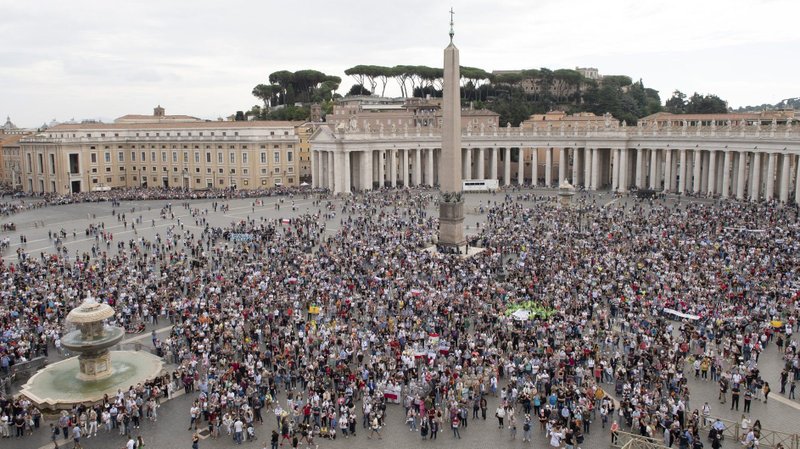People attend the Angelus led by Pope Francis from the window of his studio overlooking St. Peter's Square at the Vatican Oct. 4, 2021. (CNS photo/Vatican Media)