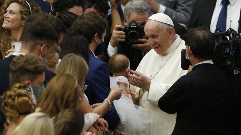 Pope Francis greets a young child during his general audience in the Paul VI hall at the Vatican Oct. 6, 2021. (CNS photo/Paul Haring)