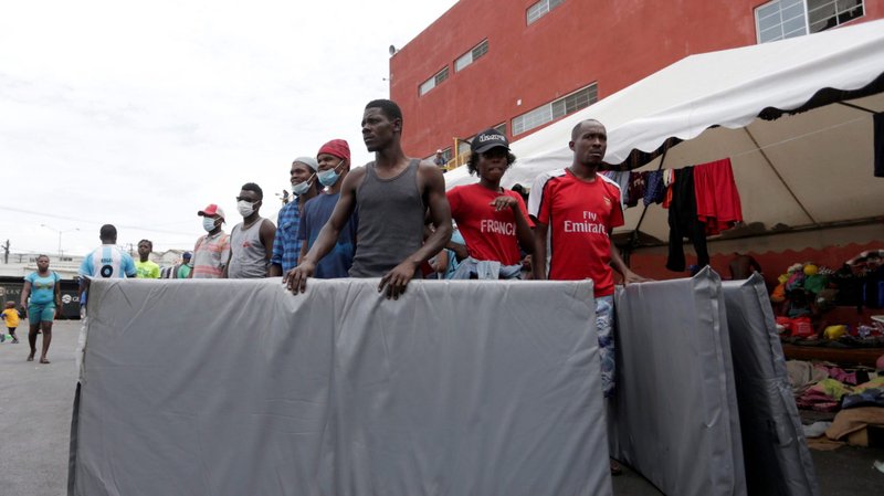 Haitian migrants seeking refuge in the U.S. are seen outside a shelter in Monterrey, Mexico, Oct. 4, 2021, as they waited to be processed by the Mexican Commission for Aid to Refugees. (CNS photo/Daniel Becerril, Reuters)