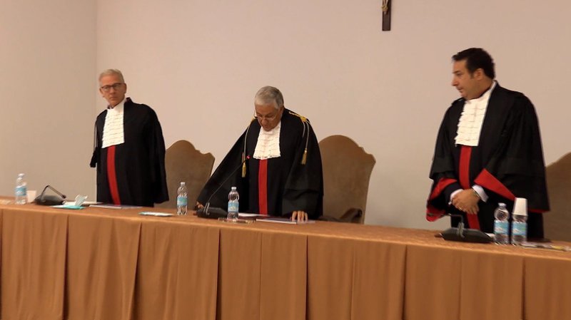 Vatican Court President Giuseppe Pignatone speaks during the verdict of Father Gabriele Martinelli and Msgr. Enrico Radice in this still image taken from video Oct. 6, 2021. The two clergymen, who were accused of sexually abusing a younger student at St. Pius X Pre-Seminary between 2007 and 2012, were cleared of the charges. (CNS photo/Vatican Media via Reuters)