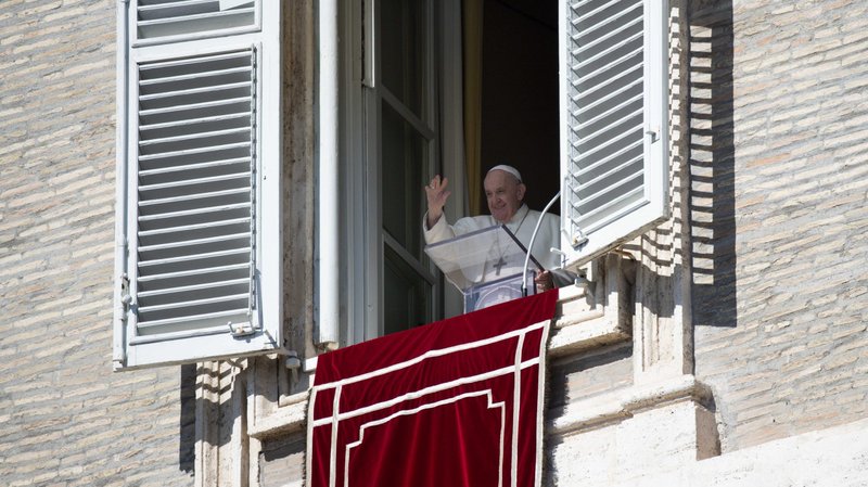 Pope Francis greets the crowd as he leads the Angelus from the window of his studio overlooking St. Peter's Square at the Vatican Oct. 10, 2021. (CNS photo/Vatican Media)