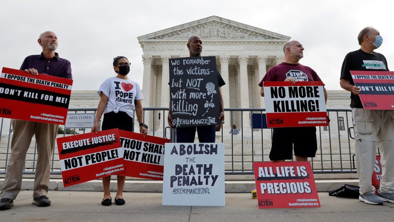 Demonstrators in Washington rally against the death penalty outside the U.S. Supreme Court building Oct. 13, 2021, where justices were hearing arguments in the federal government's bid to reinstate Boston Marathon bomber Dzhokhar Tsarnaev's death sentence. (CNS photo/Jonathan Ernst, Reuters)