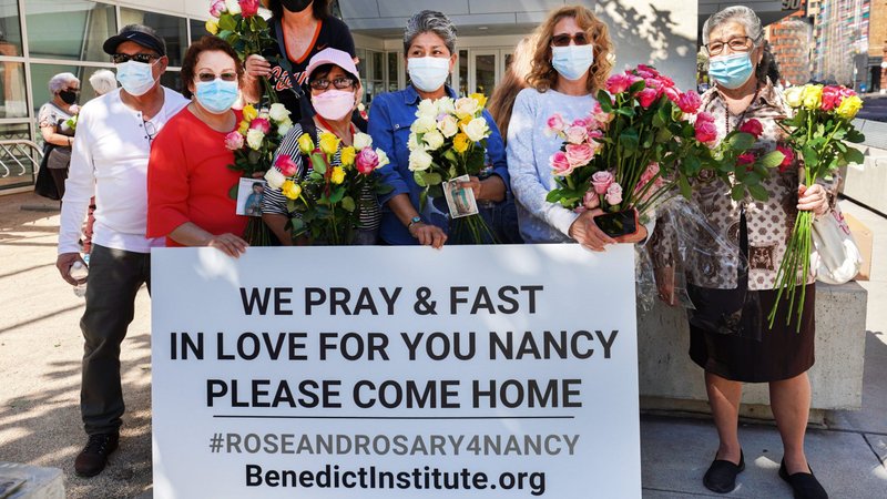 People in San Francisco deliver roses to House Speaker Nancy Pelosi's office in California Oct. 1, 2021. Each of the roses represents one Catholic praying a rosary and fasting on Fridays through October for Pelosi's "change of heart on abortion." (CNS photo/Dennis Callahan, Archdiocese of San Francisco)