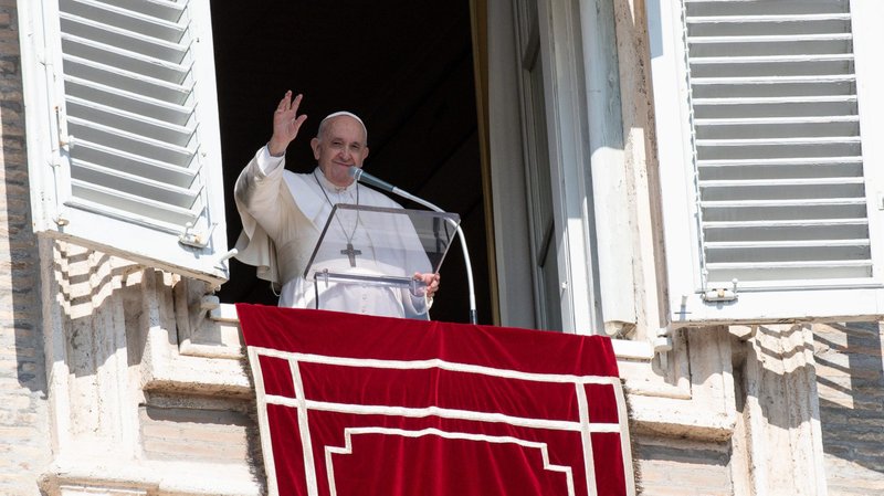 Pope Francis greets the crowd as he leads the Angelus from the window of his studio overlooking St. Peter's Square at the Vatican Oct. 17, 2021. (CNS photo/Vatican Media)