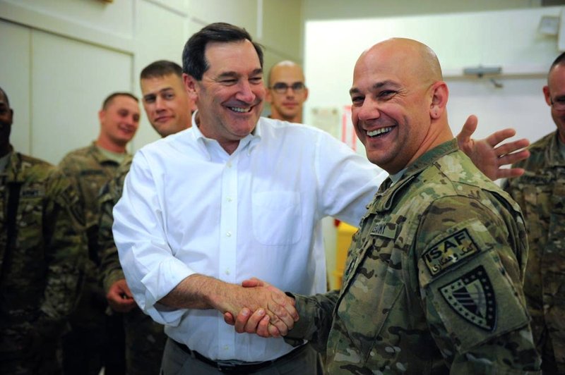 In a file photo, then-Senator Joseph Donnelly with U.S. service members of the International Security Assistance Force in Afghanistan. (Wikimedia Commons/U.S. Senate)