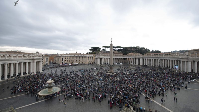 People in St. Peter's Square attend Pope Francis' recitation of the Angelus from the window of his studio overlooking the square at the Vatican Nov. 1, 2021, the feast of All Saints. (CNS photo/Vatican Media)