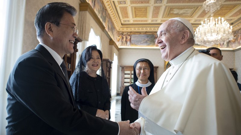 Pope Francis shakes hands with South Korean President Moon Jae-in during a meeting at the Vatican Oct. 29, 2021. (CNS photo/Vatican Media)