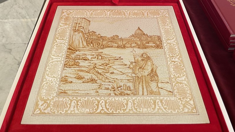 A painted ceramic tile depicting a pilgrim making his way along the Tiber River to the Vatican was one of the gifts Pope Francis gave to U.S. President Joe Biden during their meeting at the Vatican Oct. 29, 2021. In the wake of the meeting, questions have arisen over whether the pope called the president a "good Catholic" and, if he did, what he meant by it. (CNS photo/Holy See Press Office)