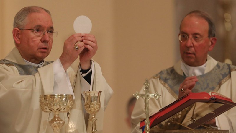 Archbishop José H. Gomez of Los Angeles, president of the U.S. Conference of Catholic Bishops, concelebrates Mass with Archbishop William E. Lori of Baltimore at the Basilica of the National Shrine of the Assumption of the Blessed Virgin Mary Nov. 15, 2021, in Baltimore during the bishops' fall general assembly. Due to the COVID-19 pandemic, it is the first in-person bishops' meeting since 2019. (CNS photo/Bob Roller)