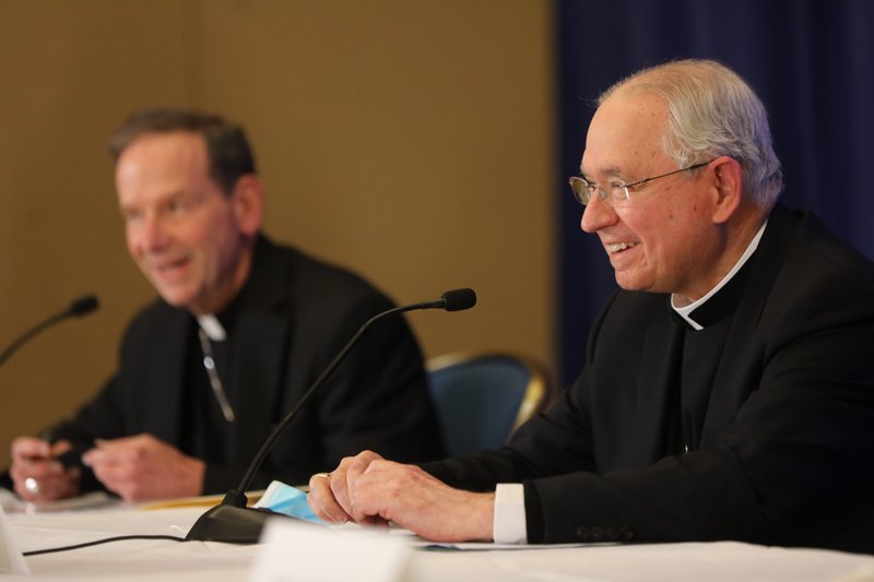 Bishop Michael F. Burbidge of Arlington, Virginia, and Archbishop José H. Gomez at a Nov. 16 news conference during the bishops' fall general assembly in Baltimore. (CNS/Bob Roller)