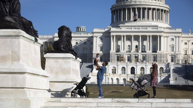 A family is seen near the U.S. Capitol in Washington Nov. 18, 2021. The Biden administration and the Department of Health and Human Services announced Nov. 18 the reversal of a Trump-era HHS rules change that ensured faith-based adoption and foster care agencies would not be excluded from federal funding for providing services consistent with their religious beliefs. (CNS photo/Tyler Orsburn)