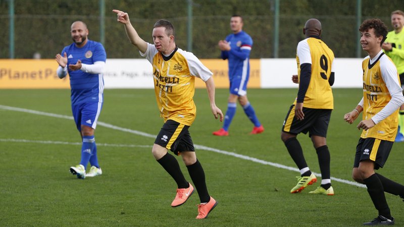 Filippo Montemurri, a player on the Vatican team, "Fratelli Tutti," celebrates after scoring a goal during a friendly soccer match against a team from the World Roma Organization at the Lazio Training Center in Formello near Rome Nov. 21, 2021. The match was played to promote inclusion, including those in Gypsy communities. (CNS photo/Paul Haring)