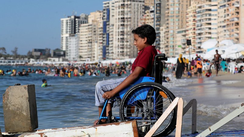 Abdelrahman Mohamed, 11, looks out at the sea from his wheelchair at the first public beach for people with disabilities in Alexandria, Egypt, July 17, 2021. Pope Francis issued a message for the Dec. 3 U.N. International Day of Persons with disabilities. (CNS photo/Mohamed Abd El Ghany, Reuters)