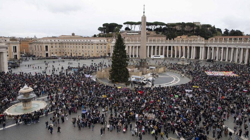 People in St. Peter's Square at the Vatican attend the Angelus led by Pope Francis from the window of his studio overlooking the square Nov. 28, 2021. (CNS photo/Vatican Media)