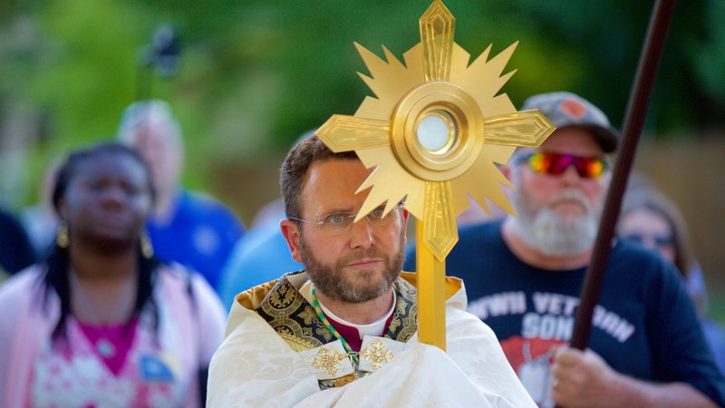 Auxiliary Bishop Andrew H. Cozzens of St. Paul and Minneapolis carries the Eucharist in a monstrance during a procession June 19, 2021. Bishop Cozzens was recently named to head the Diocese of Crookston, Minn., and will be installed Dec. 6. (CNS photo/Dave Hrbacek, The Catholic Spirit)