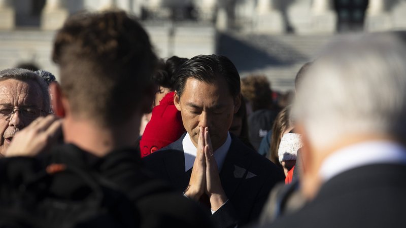 A group from Liberty University in Lynchburg, Va,. prays outside the U.S. Capitol in Washington Dec. 1, 2021, the day Supreme Court justices heard oral arguments in a case about a Mississippi law that bans abortions after 15 weeks of gestation. (CNS photo/Tyler Orsburn)