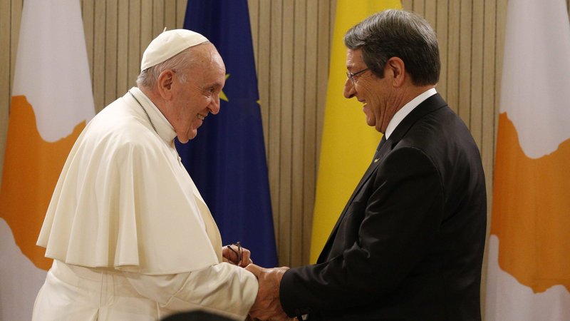Pope Francis is greeted by Cypriot President Nicos Anastasiades as he arrives for a meeting with government authorities, civic leaders and members of the diplomatic corps in the Ceremonial Hall of the presidential palace in Nicosia, Cyprus, Dec. 2, 2021. (CNS photo/Paul Haring)