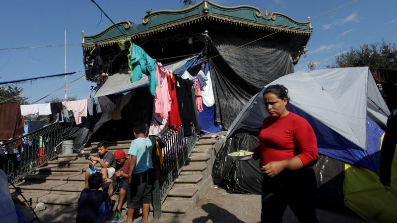 Migrants seeking asylum in the U.S. are pictured at at an encampment in a public square in Reynosa, Mexico, Dec. 3, 2021. In a Dec. 6 statement, the Mexican bishops expressed disappointment with their government's willingness to reinstate the Migrant Protection Protocols, known as Remain in Mexico. (CNS photo/Daniel Becerril, Reuters)
