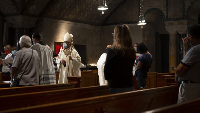 Washington Cardinal Wilton D. Gregory processes into Mass in the Crypt Church at the Basilica of the National Shrine of the Immaculate Conception in Washington Sept. 16, 2021. The percentage of Catholics in the U.S. population in 2021 held steady at 21% in the latest Pew Research Center survey, issued Dec. 14. (CNS photo/Tyler Orsburn)