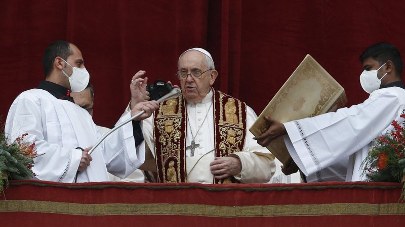 Pope Francis delivers his Christmas blessing "urbi et orbi" (to the city and the world) from the central balcony of St. Peter's Basilica at the Vatican Dec. 25, 2021. (CNS photo/Paul Haring)