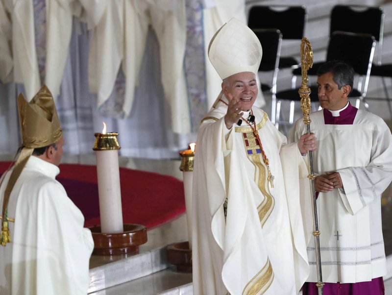Cardinal Carlos Aguiar Retes stands with his crosier as he acknowledges the congregation during his installation as the new archbishop of Mexico City Feb. 5 at the Basilica of Our Lady of Guadalupe. (Jorge Nunez/EPA via CNS.)