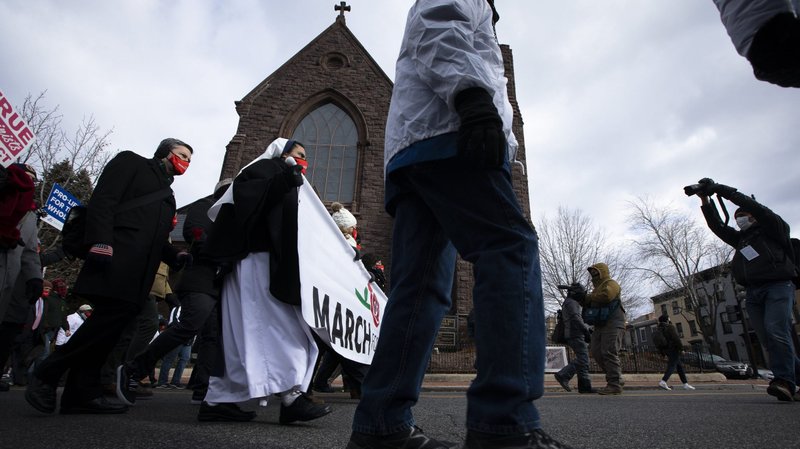 March for Life participants walk past St. Joseph's on Capitol Hill Church on their way to the U.S. Supreme Court building in Washington Jan. 29, 2021, amid the coronavirus pandemic. (CNS photo/Tyler Orsburn)