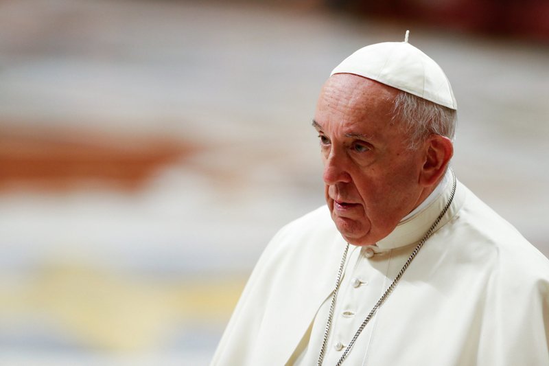 Pope Francis leaves at the conclusion of an evening prayer service in St. Peter's Basilica at the Vatican Dec. 31, 2021. (CNS/Remo Casilli, Reuters)