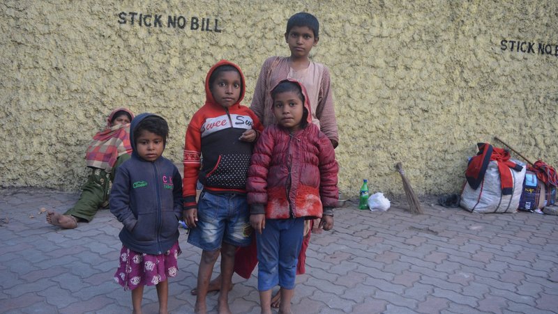 Children living on the street are seen outside the Missionaries of Charity motherhouse and orphanage in Kolkata, India, Jan. 2, 2022. Although the Indian Home Ministry has not approved the order's Foreign Contribution Regulation Act, the nuns are hoping for some support from state governments. (CNS photo/Saadia Azim)