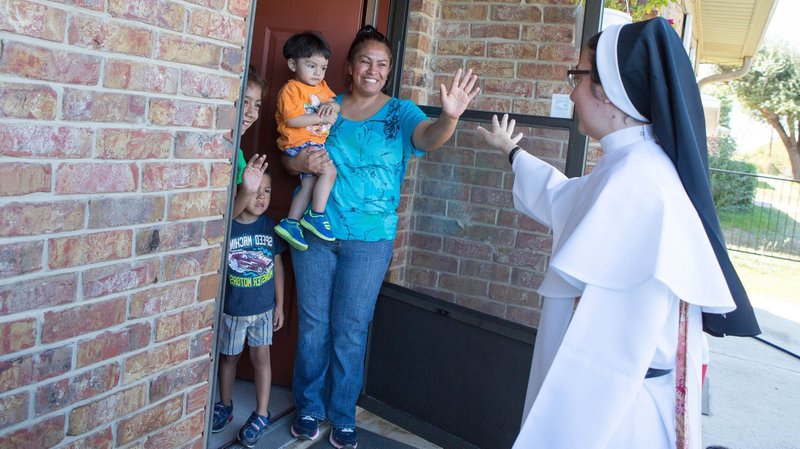 Sister Gabriela Luna Diaz, a member of the Eucharistic Missionaries of St. Teresa, visits a Hispanic family in northwestern Wisconsin in this Oct. 14, 2015, file photo. The Vatican released Pope Francis' message for World Mission Sunday, which will be celebrated Oct. 23 with the theme, "You shall be my witnesses." (CNS photo/Rich Kalonick, Catholic Extension)