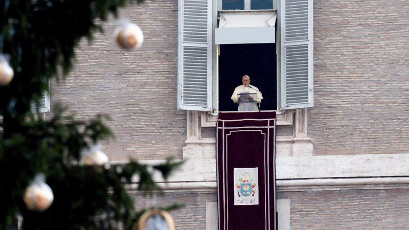The Christmas tree is seen as Pope Francis leads the Angelus from the window of his studio overlooking St. Peter's Square at the Vatican Jan. 9, 2022. The pope prayed for peace in Kazakhstan. (CNS photo/Vatican Media)