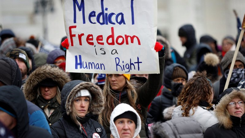 People in Albany, N.Y., demonstrate against COVID-19 vaccine mandates Jan. 5, 2022. The U.S. Supreme Court blocked the Biden administration's vaccine-or-testing mandate for large employers in a Jan. 13 ruling. In a separate decision, the court upheld the mandate for most health care workers. (CNS photo/Mike Segar, Reuters)