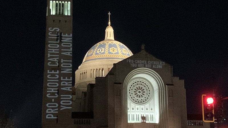 Supporters of legal abortion project a message on the Basilica of the National Shrine of the Immaculate Conception in Washington as pro-life advocates attend the National Prayer Vigil for Life Jan. 20, 2022, inside the shrine's Upper Church. (CNS photo/Ashley Wilson, courtesy Catholics for Choice)