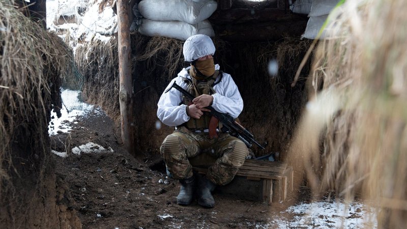 A service member of the Ukrainian armed forces is seen at combat positions at the line of separation from Russian-backed rebels near the village of Novomykhalivka in the Donetsk region, Ukraine, Jan. 21, 2022. Pope Francis at his Jan. 23 Sunday Angelus said he is deeply concerned by growing tensions between Russia and Ukraine and called for a day of prayer for peace Jan. 26. (CNS photo/Anna Kudriavtseva, Reuters)