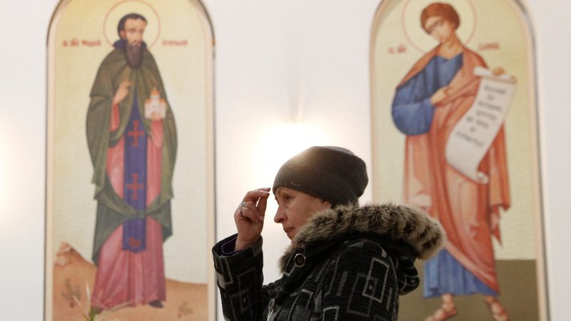 A believer attends a liturgy at the Ukrainian Catholic Cathedral of the Resurrection of Christ in Kyiv Jan. 26, 2022. Pope Francis appealed for an end to all war and prayed that dialogue, the common good and reconciliation would prevail. The pope made his remarks Jan. 26, the day he had set for worldwide prayers for peace in Ukraine. (CNS photo/Valentyn Ogirenko, Reuters)