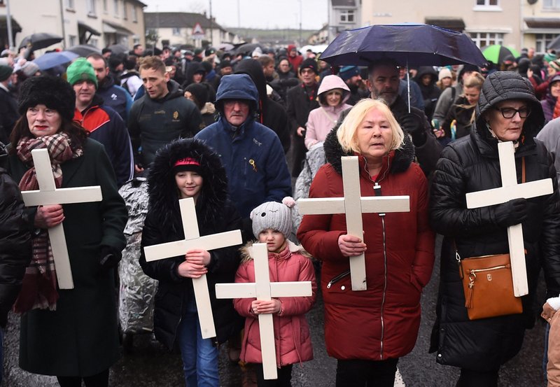 Women and children carry crosses during a memorial service to mark the 50th anniversary of Bloody Sunday in Londonderry, Northern Ireland, Jan. 30, 2022. The head of the Irish bishops' conference has noted that no one has ever been prosecuted for the British army killing of 14 unarmed Catholics in 1972. (CNS photo/Clodagh Kilcoyne, Reuters)